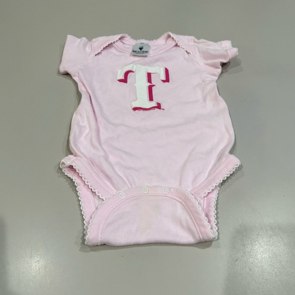 Soft as a Grape Pink Baby Onesie with Texas Rangers Logo.  12 Months